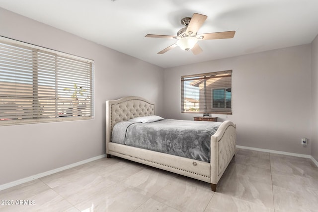 bedroom with baseboards and a ceiling fan