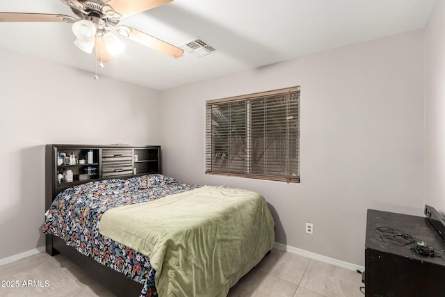 bedroom featuring light tile patterned floors, a ceiling fan, visible vents, and baseboards