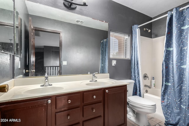 full bathroom featuring toilet, double vanity, shower / bath combo, and tile patterned floors