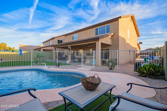 view of swimming pool with a fenced in pool, a fenced backyard, and a patio