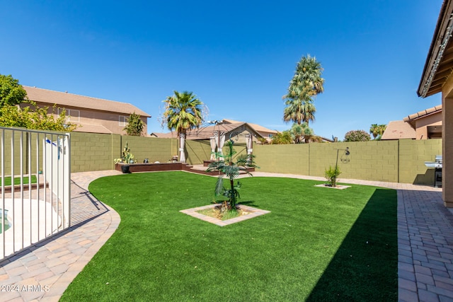 view of yard with a gazebo and a patio area