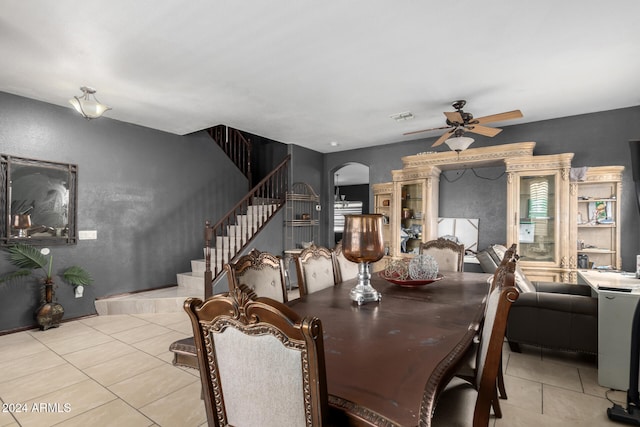 tiled dining area with ceiling fan