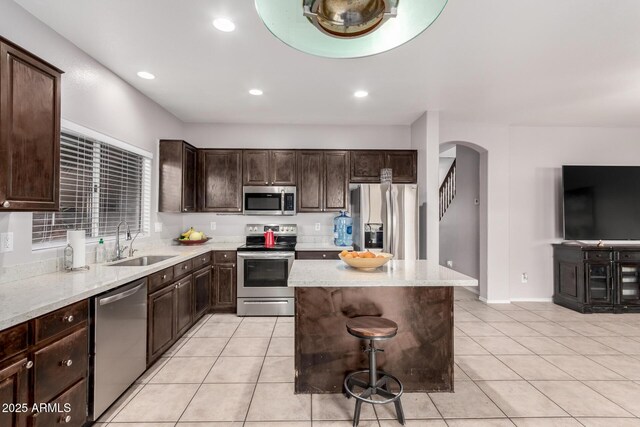 living room with light tile patterned flooring, an inviting chandelier, and washer / dryer