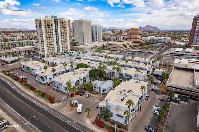 birds eye view of property featuring a mountain view