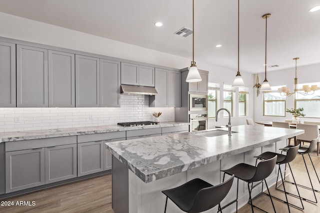35612 N Lodestone Dr, San Tan Valley, AZ 85144 - kitchen with gray cabinetry, stainless steel appliances, a sink, decorative backsplash, and recessed lighting