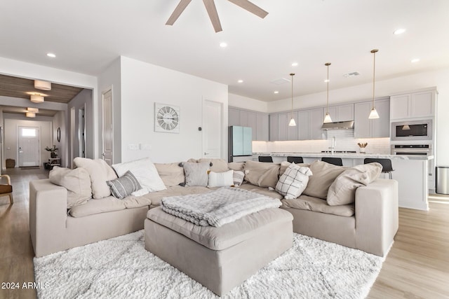 35612 N Lodestone Dr, San Tan Valley, AZ 85144 - living area with a ceiling fan, light wood-style flooring, and recessed lighting