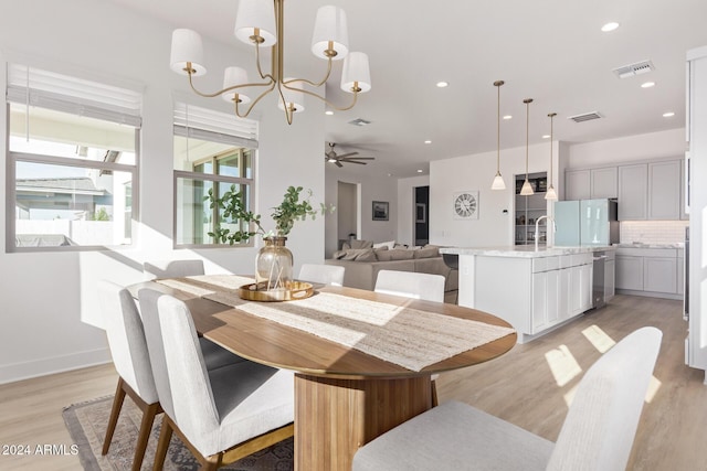 35612 N Lodestone Dr, San Tan Valley, AZ 85144 - dining area with light wood-style flooring, recessed lighting, a chandelier, and ceiling fan