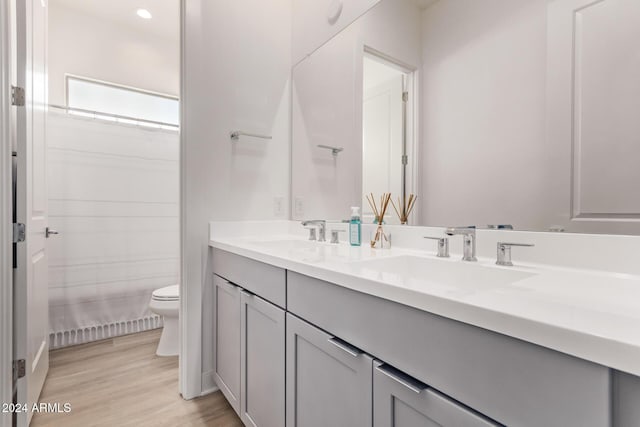 35612 N Lodestone Dr, San Tan Valley, AZ 85144 - full bath featuring toilet, double vanity, wood finished floors, recessed lighting, and a shower with curtain