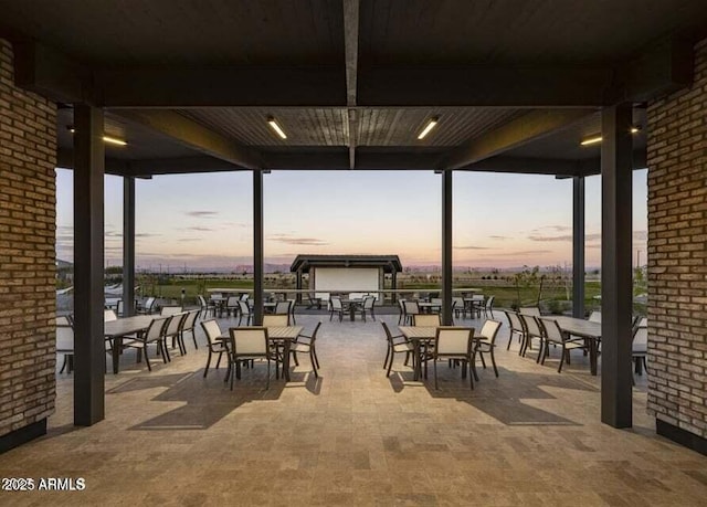 35612 N Lodestone Dr, San Tan Valley, AZ 85144 - patio terrace at dusk with outdoor dining space