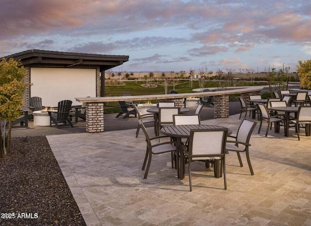 35612 N Lodestone Dr, San Tan Valley, AZ 85144 - patio terrace at dusk featuring outdoor dining area and a patio area