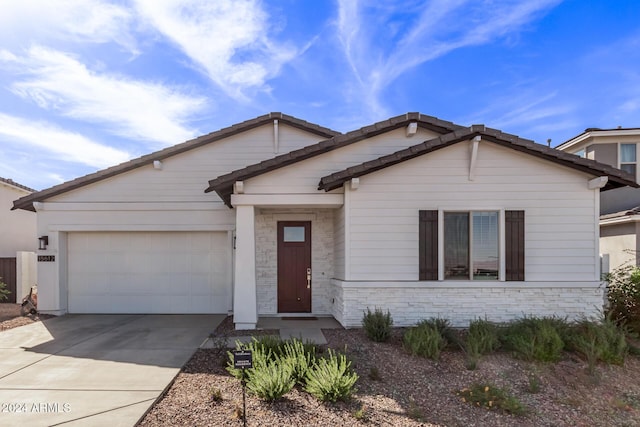 35612 N Lodestone Dr, San Tan Valley, AZ 85144 - view of front of home featuring a garage, concrete driveway, and stone siding