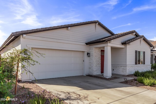 35612 N Lodestone Dr, San Tan Valley, AZ 85144 - view of front facade with a garage, driveway, brick siding, and stone siding