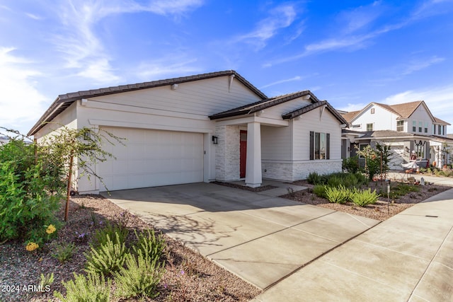 35612 N Lodestone Dr, San Tan Valley, AZ 85144 - ranch-style house featuring a garage, concrete driveway, and stone siding