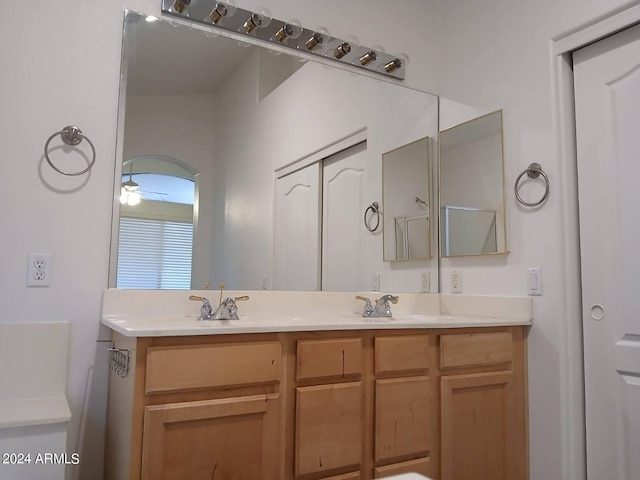 bathroom with ceiling fan and vanity