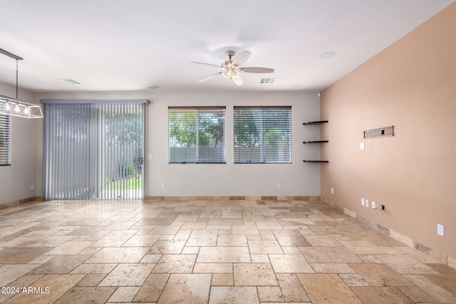 spare room with ceiling fan