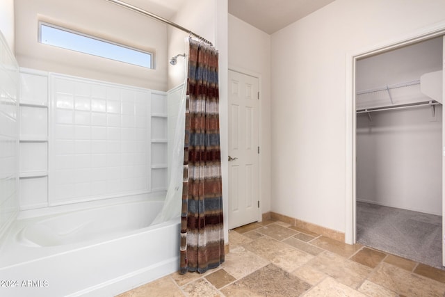 bathroom with shower / bathtub combination with curtain