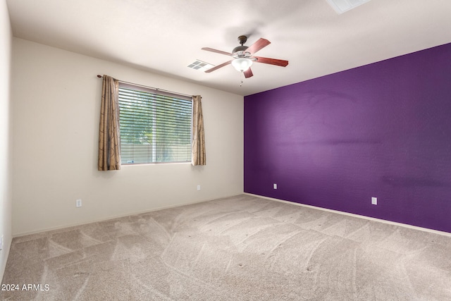 carpeted empty room with ceiling fan