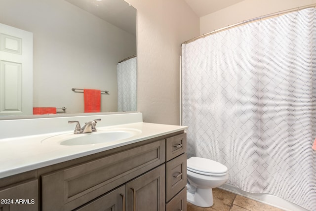 bathroom featuring vanity, walk in shower, toilet, and tile patterned flooring