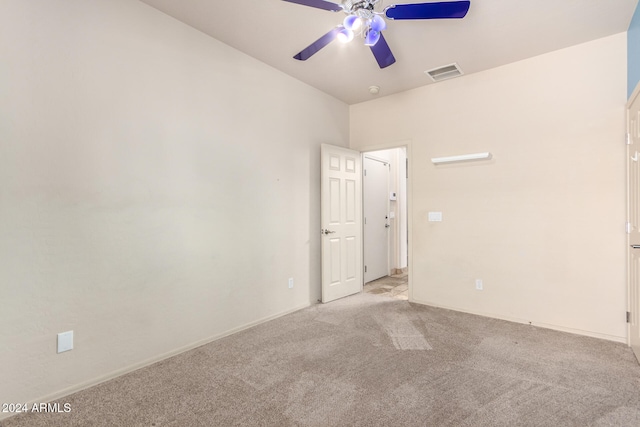 carpeted empty room with ceiling fan