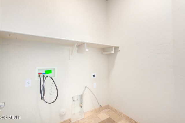 washroom featuring hookup for an electric dryer, gas dryer hookup, and washer hookup