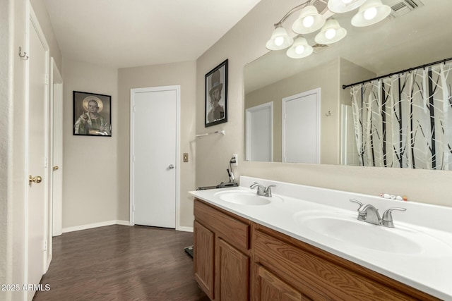 bathroom with vanity and hardwood / wood-style flooring