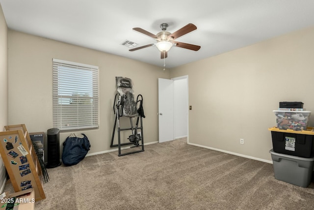 misc room with ceiling fan and carpet flooring