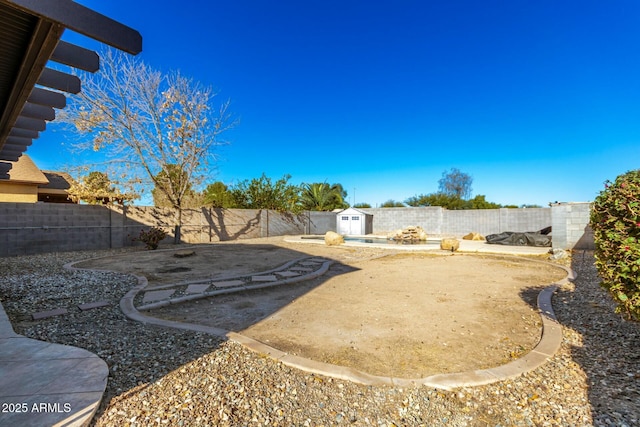 view of yard with a patio area and a storage unit