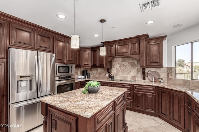 kitchen with stainless steel appliances, light stone countertops, visible vents, and recessed lighting