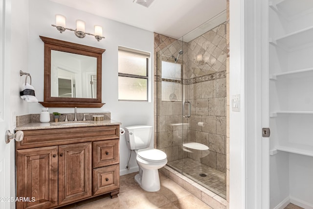 bathroom with visible vents, tile patterned flooring, a stall shower, vanity, and toilet