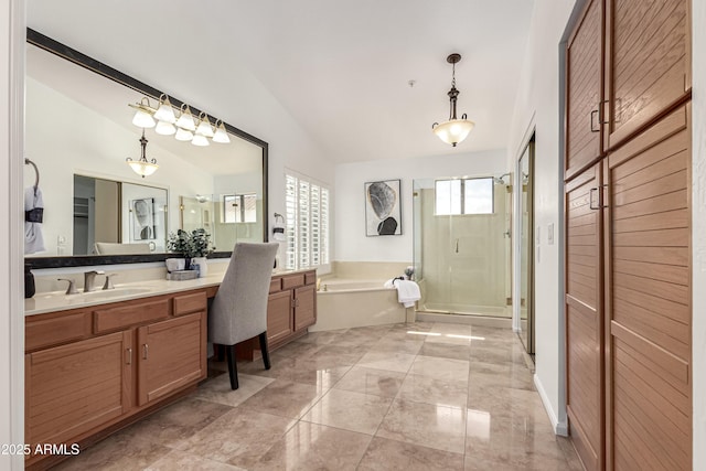 bathroom with vanity, a garden tub, a stall shower, and vaulted ceiling