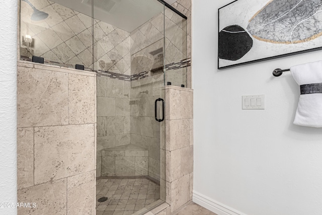 full bath featuring baseboards, visible vents, and a stall shower