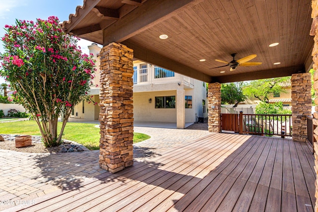 wooden terrace with a patio, a ceiling fan, and fence