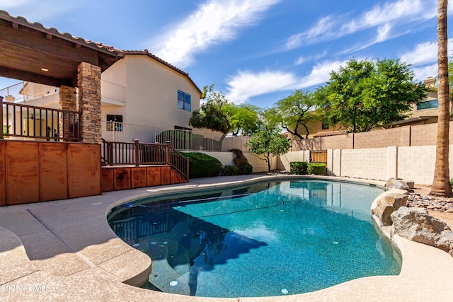 view of swimming pool with a fenced in pool and a fenced backyard