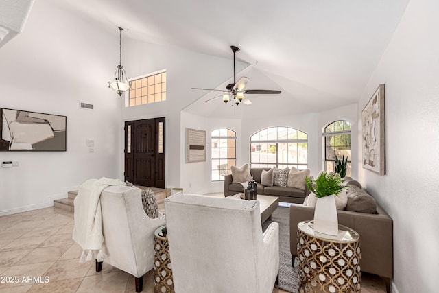 living room with plenty of natural light, visible vents, a ceiling fan, and lofted ceiling