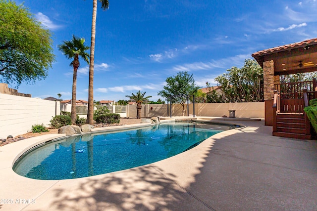 view of pool with a fenced in pool, a fenced backyard, ceiling fan, and a patio area