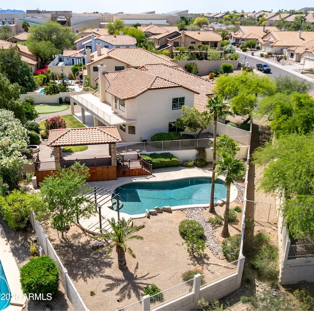 view of swimming pool with fence private yard, a patio area, a residential view, and a fenced in pool