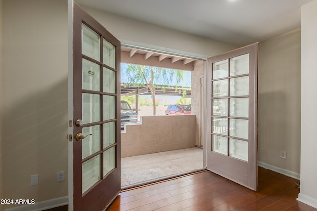 doorway to outside with wood-type flooring and french doors