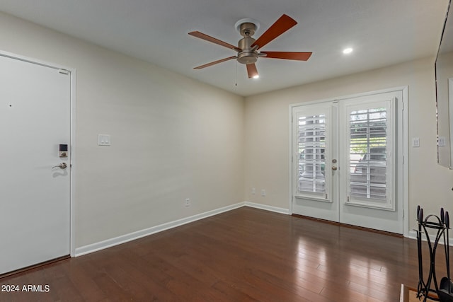 foyer with french doors, ceiling fan, and dark wood-type flooring