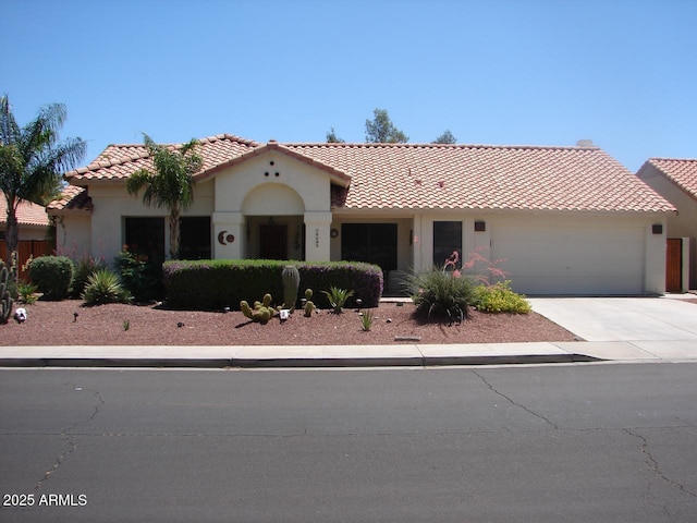 14605 S 35th Pl, Phoenix, AZ 85044 - mediterranean / spanish house featuring a tiled roof, an attached garage, driveway, and stucco siding