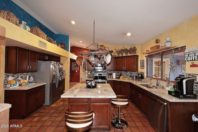14605 S 35th Pl, Phoenix, AZ 85044 - kitchen with a sink, stainless steel appliances, decorative backsplash, a center island, and recessed lighting