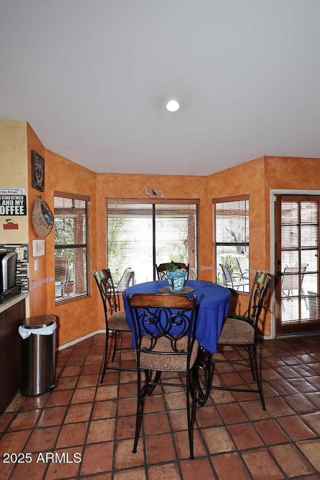 14605 S 35th Pl, Phoenix, AZ 85044 - dining area with plenty of natural light, dark tile patterned floors, and baseboards