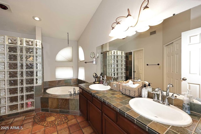 14605 S 35th Pl, Phoenix, AZ 85044 - full bathroom with walk in shower, a garden tub, double vanity, vaulted ceiling, and recessed lighting