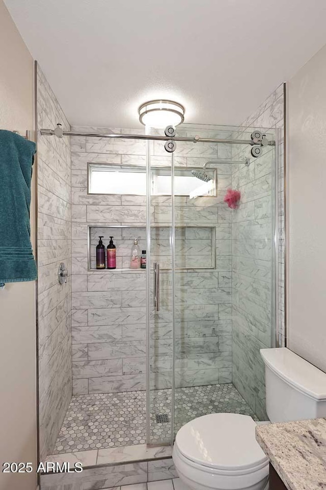 14605 S 35th Pl, Phoenix, AZ 85044 - full bath with toilet, a shower stall, marble look tile flooring, and vanity