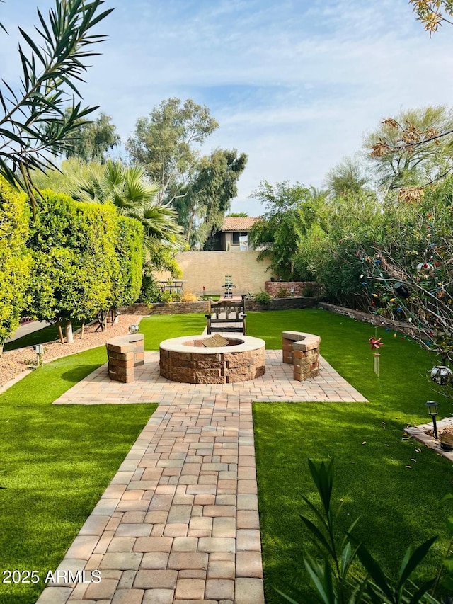 14605 S 35th Pl, Phoenix, AZ 85044 - view of community featuring an outdoor fire pit, a patio area, and a lawn