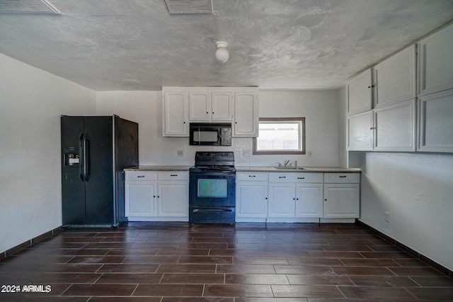 kitchen featuring white cabinets, dark hardwood / wood-style floors, sink, and black appliances