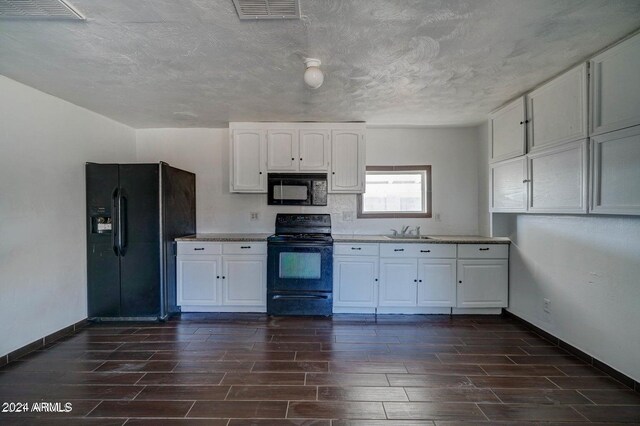 753 W Riverside St, Phoenix, AZ 85041 - kitchen with black appliances, wood finish floors, white cabinetry, light countertops, and a textured ceiling