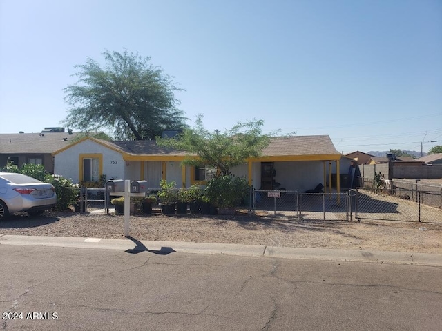 753 W Riverside St, Phoenix, AZ 85041 - view of front of house with a fenced front yard, a gate, and stucco siding