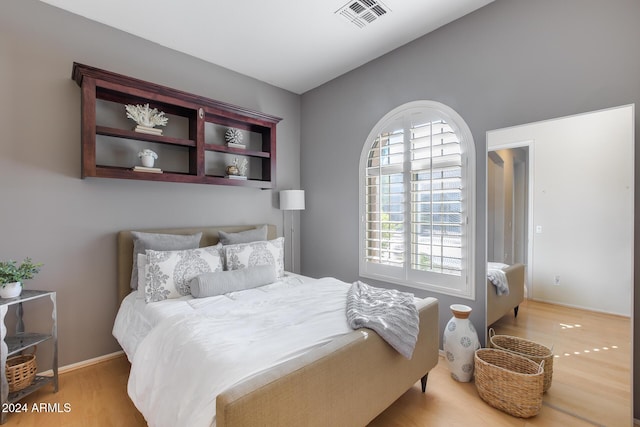 2340 W Horsetail Trl, Phoenix, AZ 85085 - bedroom with wood finished floors and lofted ceiling