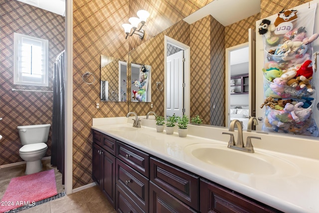 2340 W Horsetail Trl, Phoenix, AZ 85085 - full bathroom with wallpapered walls, tile patterned floors, double vanity, and toilet
