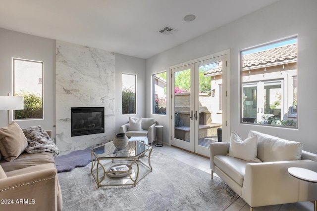 2340 W Horsetail Trl, Phoenix, AZ 85085 - living area with french doors, plenty of natural light, and a premium fireplace